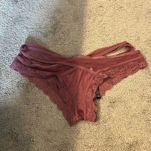 Cheeky thong. Never worn. Silk and lace detail.